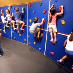 Kids climb a rock wall at the Glazer Children's Museum, which offers free admission on the first Tuesday of each month. / Courtesy of the Tampa Tribune